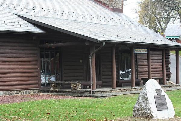 The front of the log cabin part of the museum