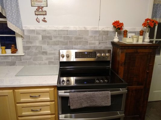 Tile backsplash in our kitchen was done by Jeff of Sauly's tile.