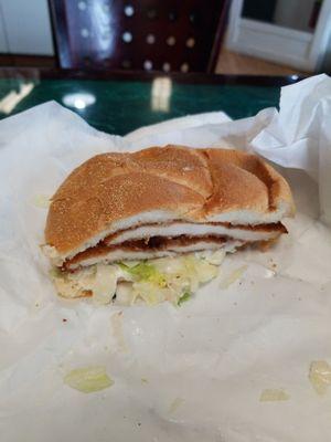 Chicken cutlet on a toasted hard roll.