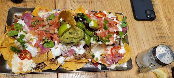 Brisket nachos. Enought for 4 people to share as appetizers.