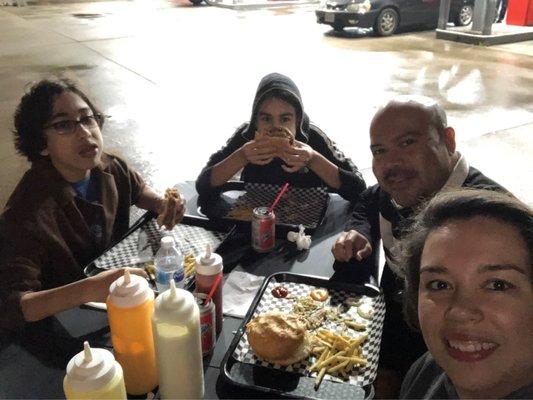 Two of our kids, the hubs and I eating yummy Venezuelan burgers.