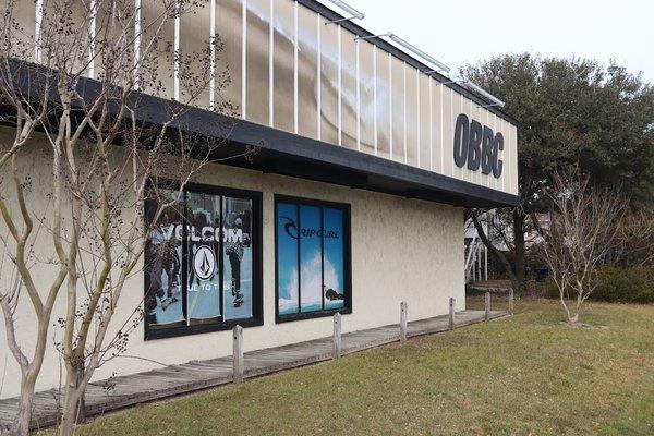 Side view of Outer Banks Boarding Company's building.