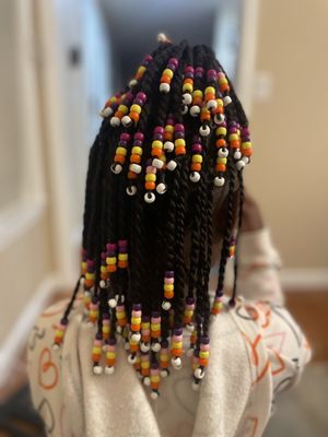 Kids natural hair twist with a touch of beads