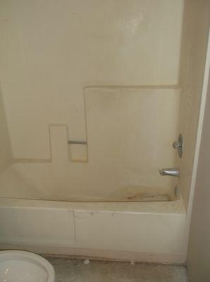 Before picture and neglected apartment tub/enclosure.