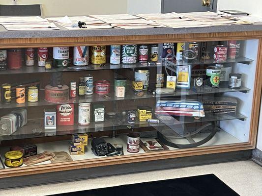 Antique coke machines n oil cans.