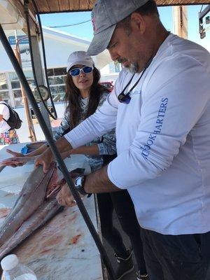 Back at the marina captain Jorge skillfully flirting out fresh catch at the same time giving. Me a lesson on how to filet properly