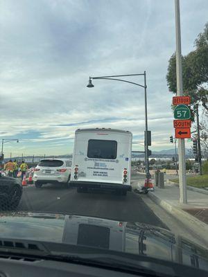 Terrible driver just ran a red light in a heavy construction zone and was speeding.