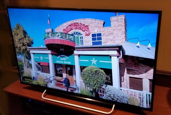 Photo of a steakhouse retaurant on a TV monitor.