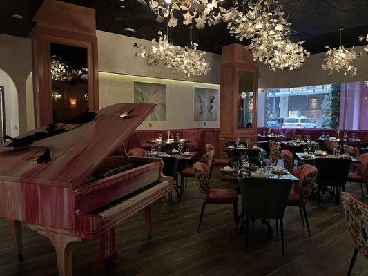 Pink piano and seating area