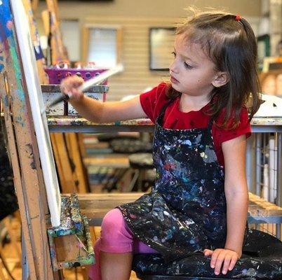 Young Child Painting during Pick & Paint Open Studio