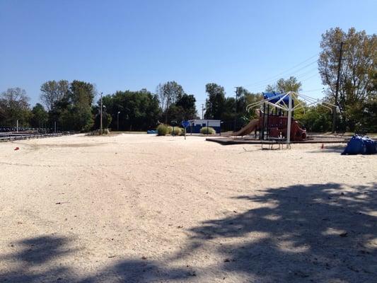 Sandy beach with playground and snack booth