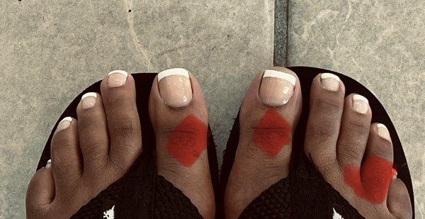 Here's my French pedicure. Do note that the red marking is purposefully placed to cover my ashy toes.