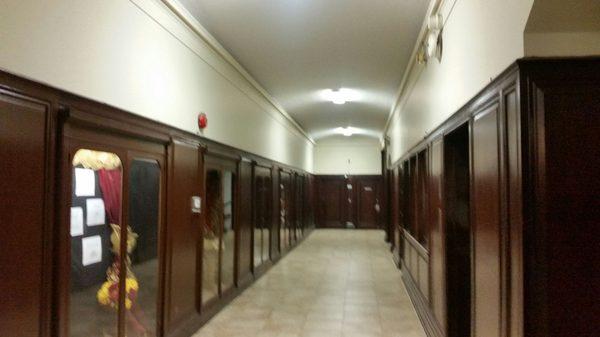 Mahogany lined hallways with built-in showcases