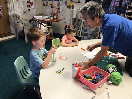 Making a straw/yarn bracelet craft