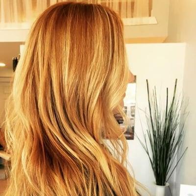 Soft golden copper base with balayage highlights. Long layers give off perfect silhouette.