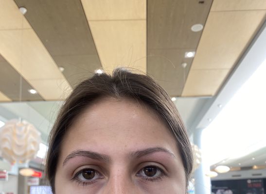 Look at my left eyebrow she left it thinner, uneven, and has a totally different shape than my right one. My right one is THICKER.