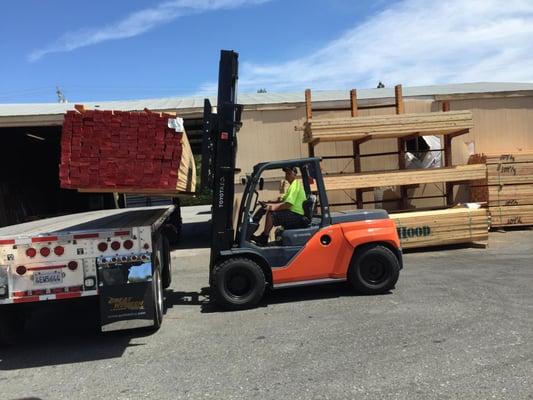 Here is a shot of a Workhorse- a brand new Toyota Forklift Model # 8FD70U in action, unloading lumber in Sunnyvale, CA