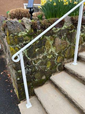 BEFORE--Left of stairs, crumbling and eroded stone wall, water leaking through