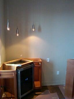 Wine cabinet install w/drop pendant lighting.