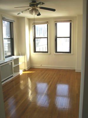 Cheery, Sun Saturated Living Room with High Ceilings and Hardwood Floors!!!