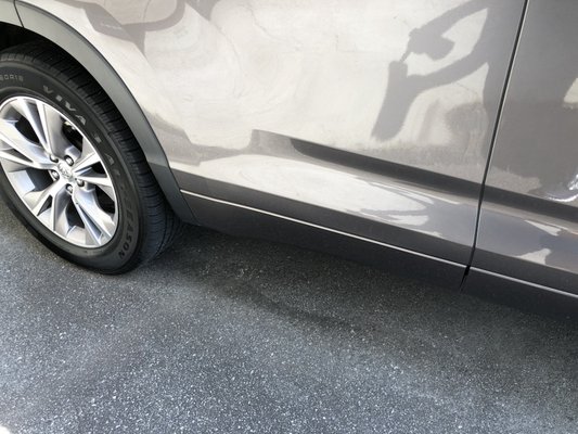 Toyota Highlander rear door-Extreme Dent Repaired (photo taken at different time of day makes vehicle appear as different color)