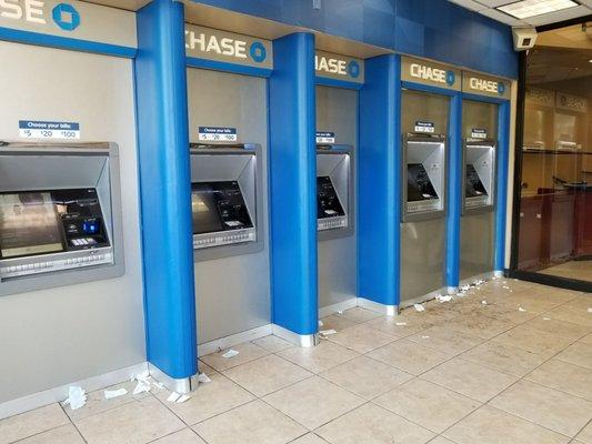 Debris and sticky floor in ATM foyer area after the weekend.