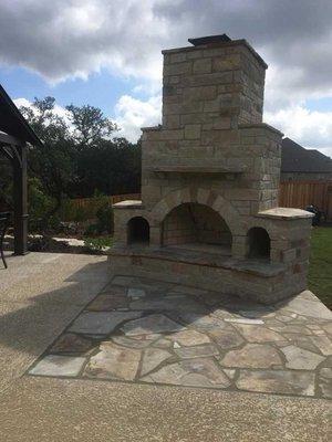 Outdoor Fireplace design by Pristine Landscaping