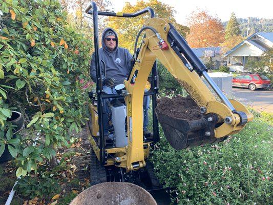 Excavating while protecting existing landscaping