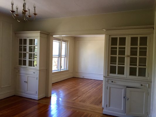 Double parlored living room with TWO built-in bookshelves