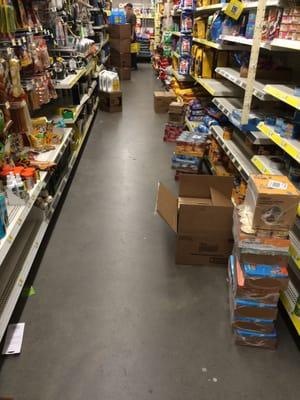 Empty shelves and boxes all over the floors.