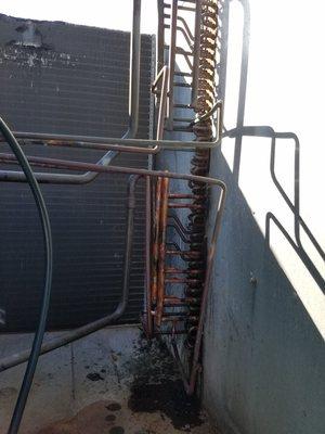 Replaced a restricted liquid line header on a commercial rooftop HVAC unit