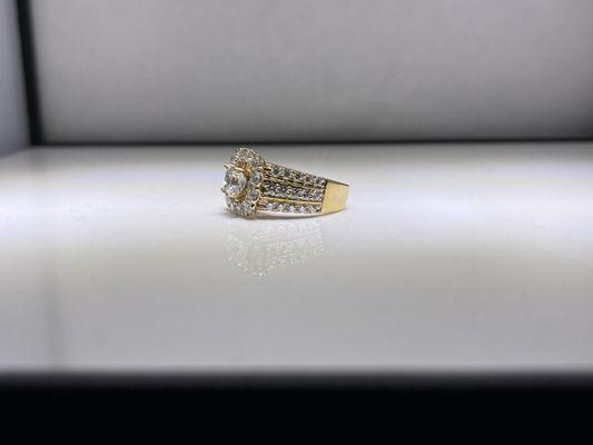 1 carat cushion center, 2 carat tdw mounting = 3 carats in 18k yellow gold