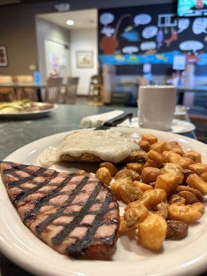 Chicken fried steak with ham and potatoes