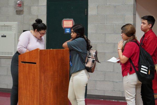 Students check in before going to their corporate work study job.