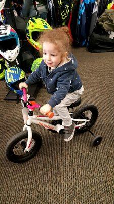 He decided to try and ride a bike for the first time while we waited...