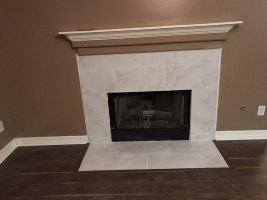 Completed tile work around fireplace