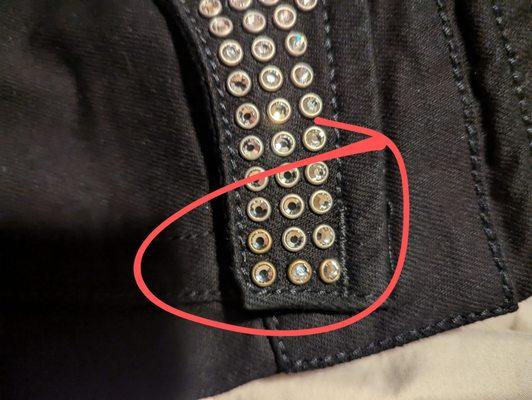 Asymmetrical studding on $400 jeans.