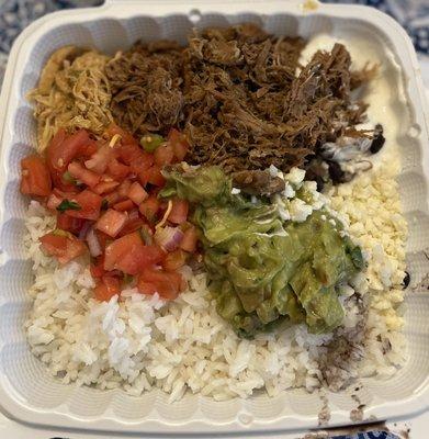 Rice bowl with three meats, pico de gallo, guacamole and cotija cheese