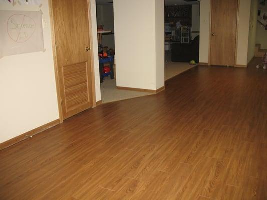 Luxury vinyl plank provides a beautiful wood look that is 100% waterproof.  Perfect for basements.