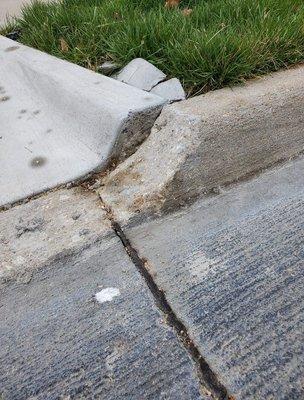 Metro Driveway did not form the concrete correctly and put concrete caps on the curb.  This was a workmanship error.