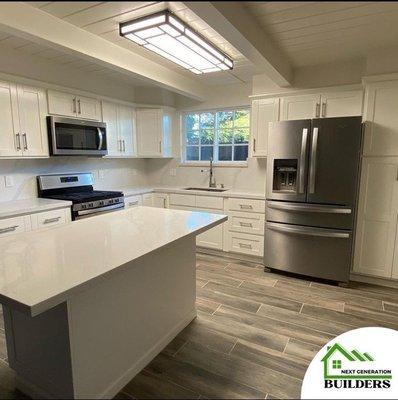 Kitchen after remodeling.Cabinets were restored, painted, added new handles and slow closing hinges