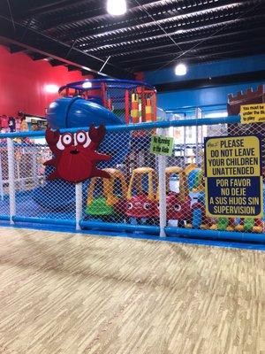 The first play area slides, tubes, and ball pit.