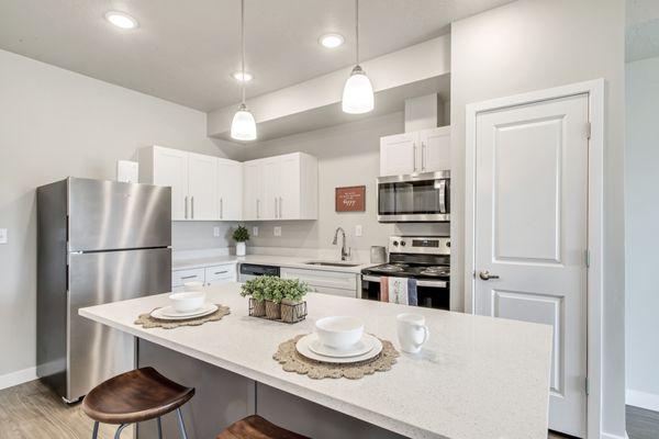 Kitchen with stainless steel appliances and kitchen island