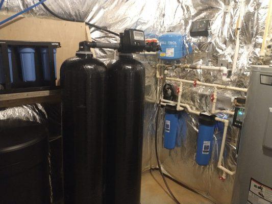 Twin Water Softener with pre and post sediment filters.