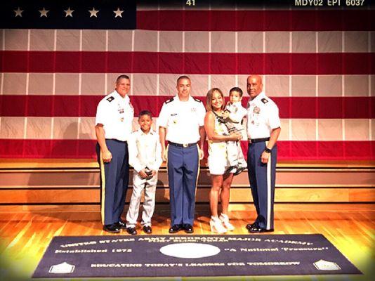 During a formal ceremony, Raymond J. Belk gets pinned CSM (Command Sergeants Major) at the USASMA by his two sons and wife.