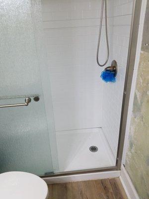 The walls of shower do not meet the base. 2 inch gap at front wall