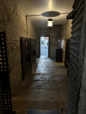 Center hallway between the two rows of jail cells.