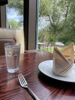 Indoor table and booths outside is table dining