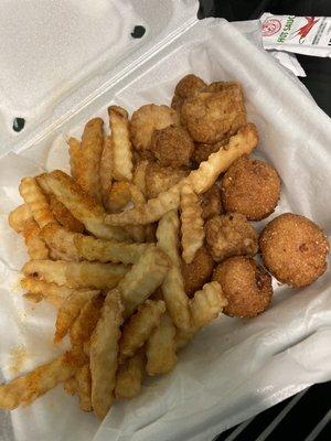 Scallops, hush puppies and fries. (I had already dug in before I took the picture, this was my leftovers!)