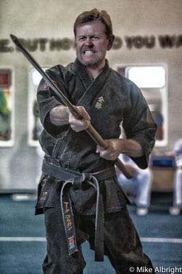 Sensei Colgan competing with his Okinawan Fisherman's Eku (oar).